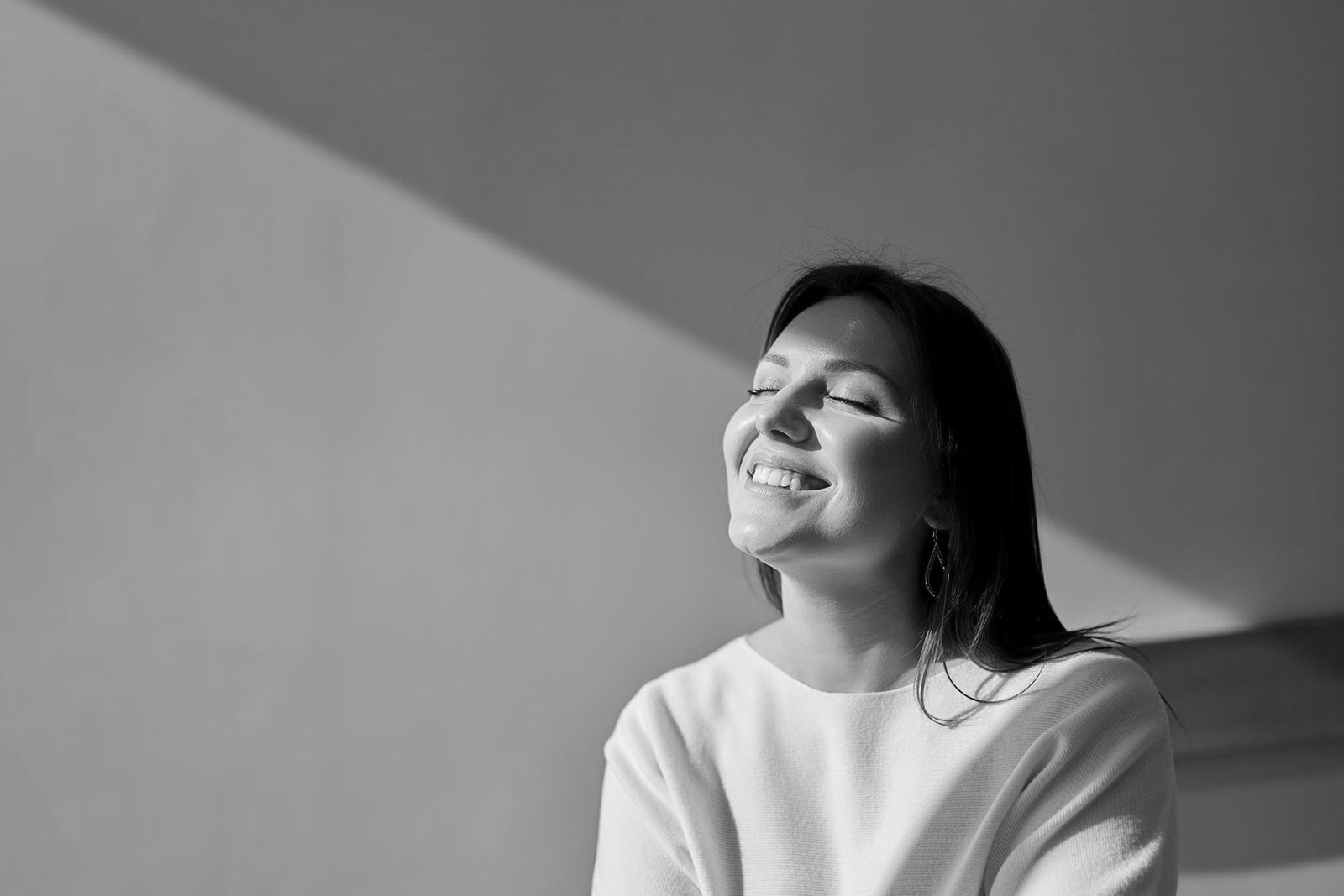 Calm woman smiling in soft light